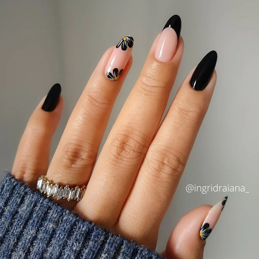 Black nails decorated with flowers