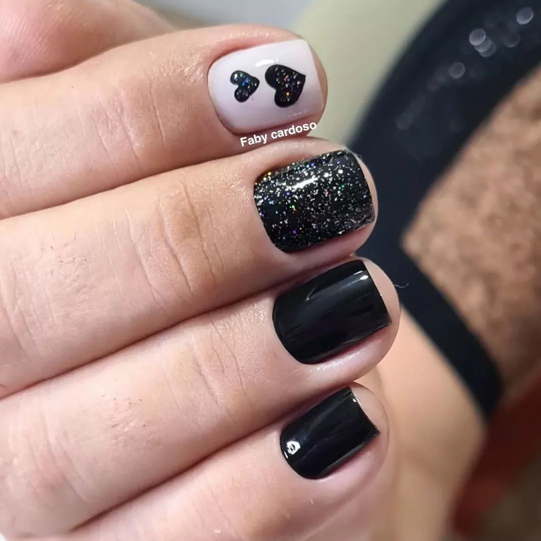 Black nails decorated with heart